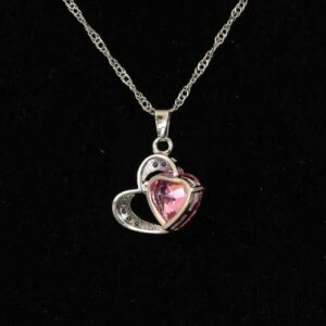 Zilveren ketting met roze steen en hart